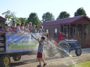 Tractor Pulling Kids With Waterguns