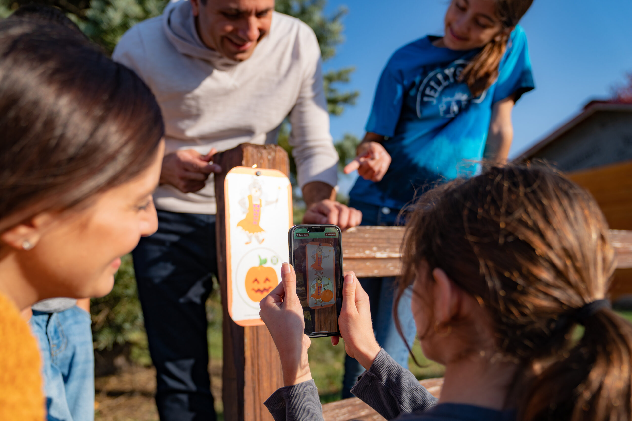 Family participating in a scavenger hunt activity at the corn maze at Jellystone Park South Haven